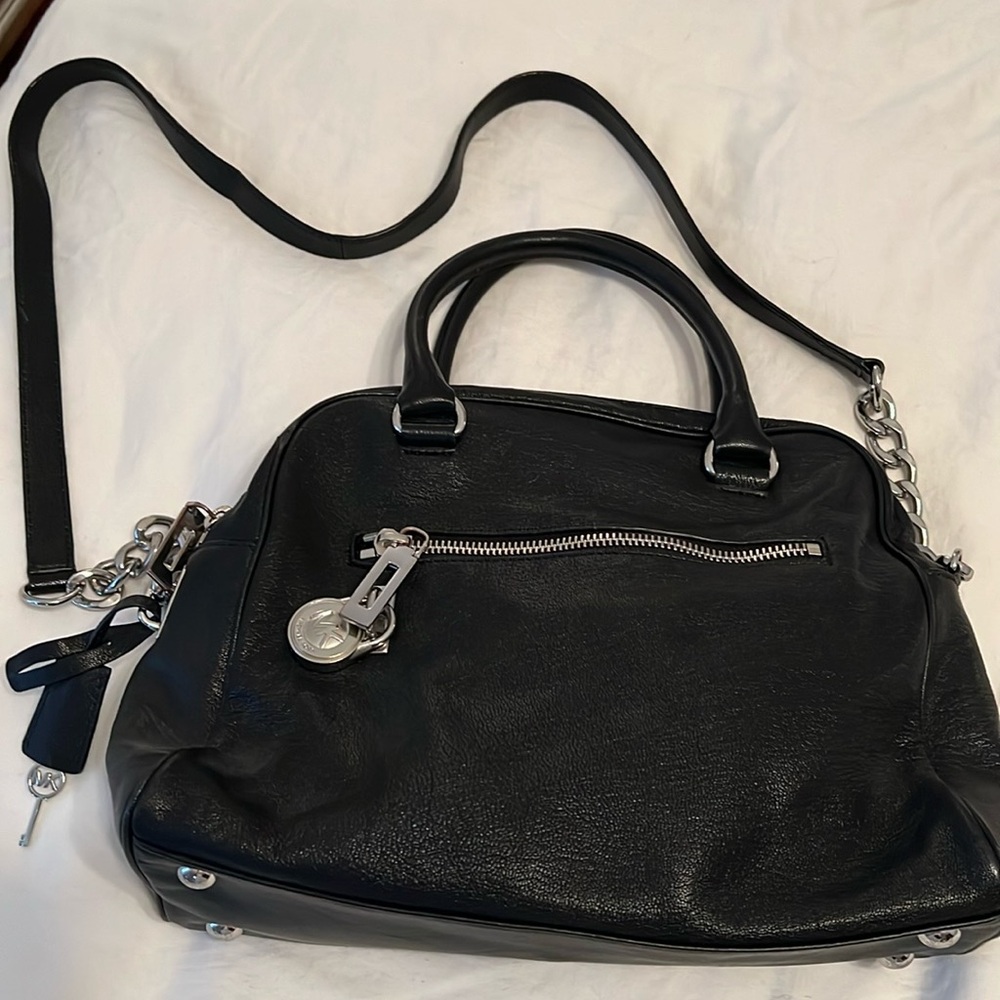 MK leather bag with silver hardware. Clean inside and no visible stains.